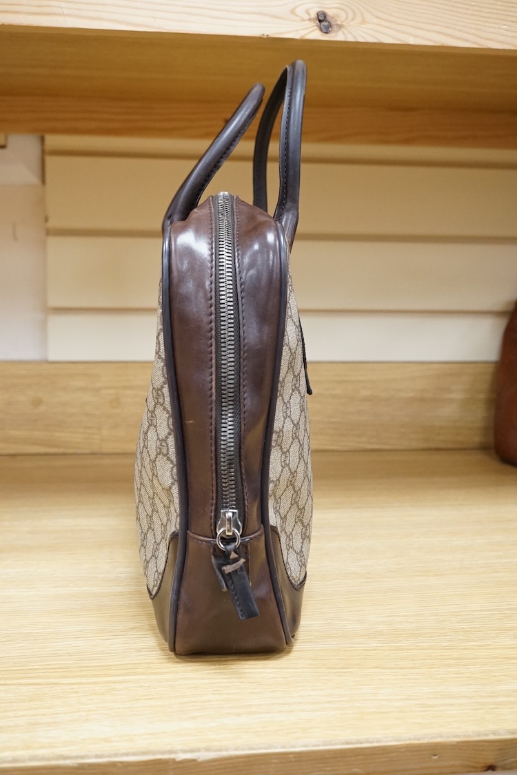 A Gucci supreme monogram travel case, 40cm wide